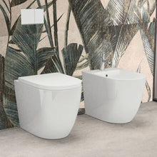 Carregar imagem no visualizador da galeria, Bidê e vaso sanitário arredondados e sem aro, com assento NEST com fechamento suave, de parede a parede
